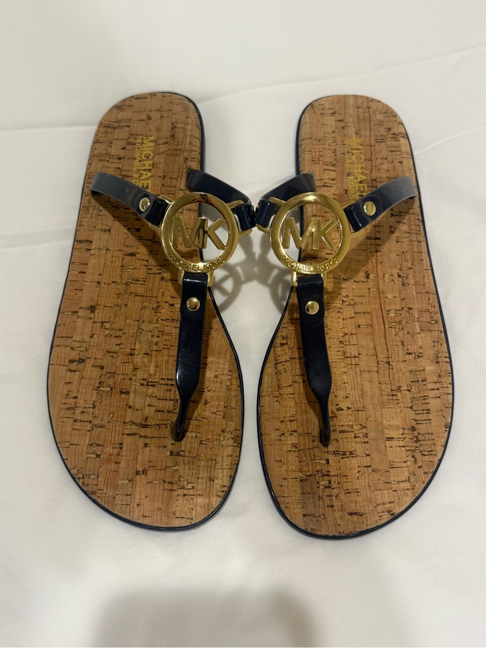 Michael Kors Black Thong Sandals with Gold MK Medallion never worn